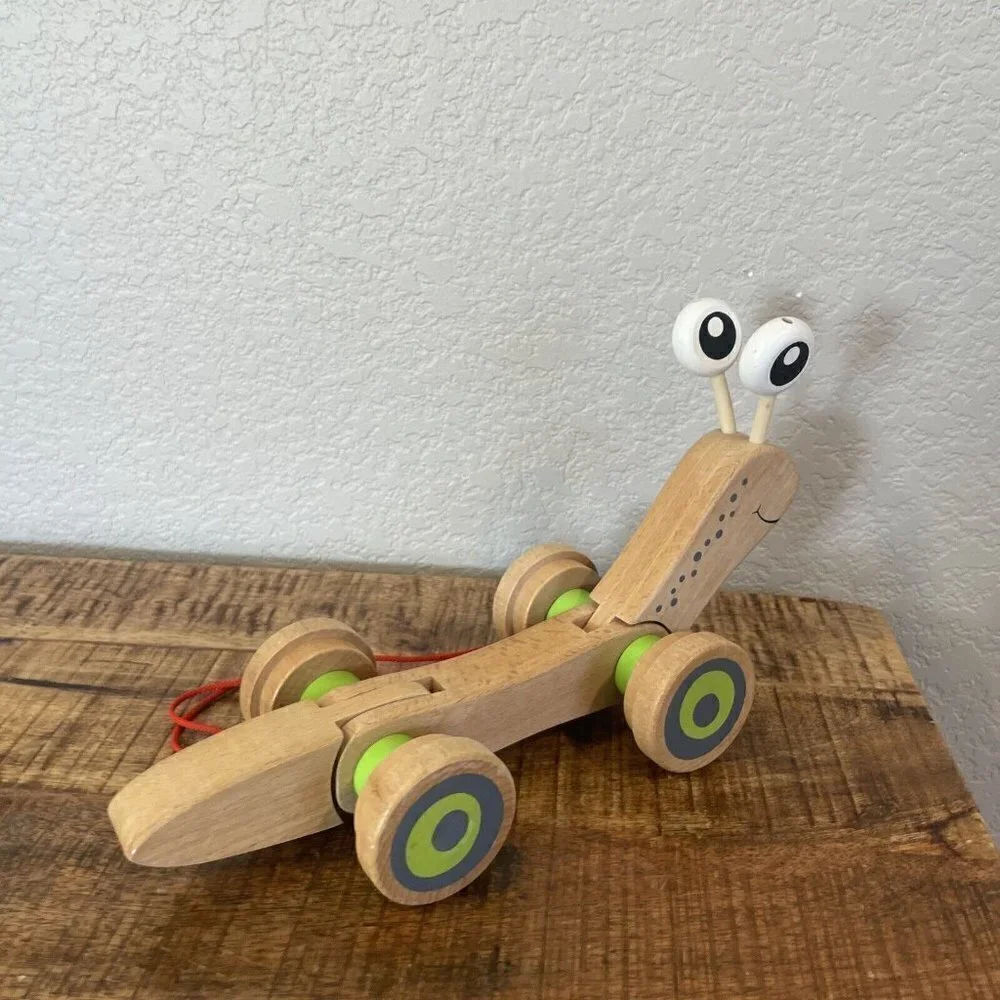 Hape Wooden Walk Along Pull Toy Snail Worm Wobbly Eyes Wheels Kids